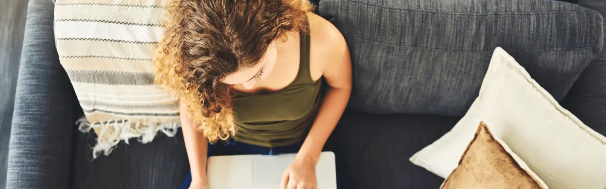 Adult woman participating in an online therapy group in the UK, focusing on CBT workshops in London